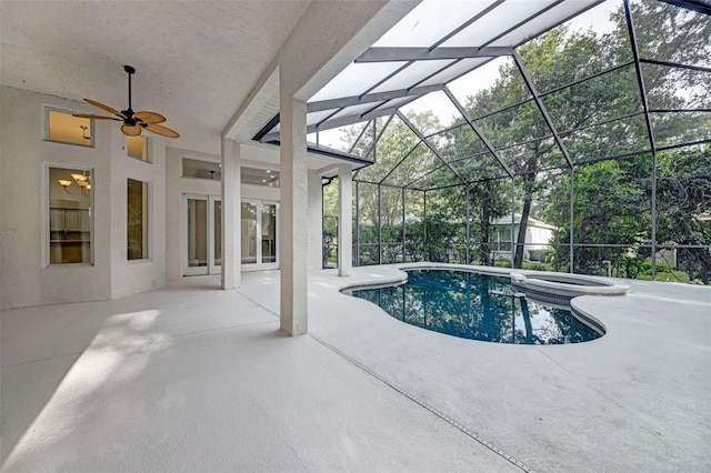 5103 Twin Creeks Dr, Valrico, FL 33596 - view of swimming pool featuring a patio, a ceiling fan, a pool with connected hot tub, glass enclosure, and a storage unit