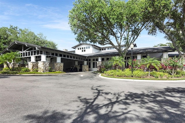 5103 Twin Creeks Dr, Valrico, FL 33596 - view of building exterior with uncovered parking