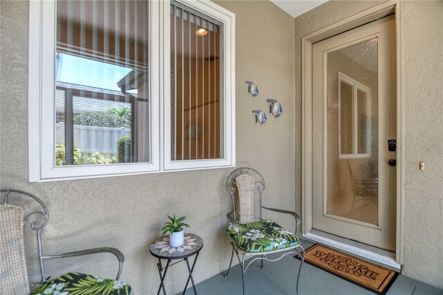8579 54th Avenue Cir E, Bradenton, FL 34211 - doorway to property with stucco siding