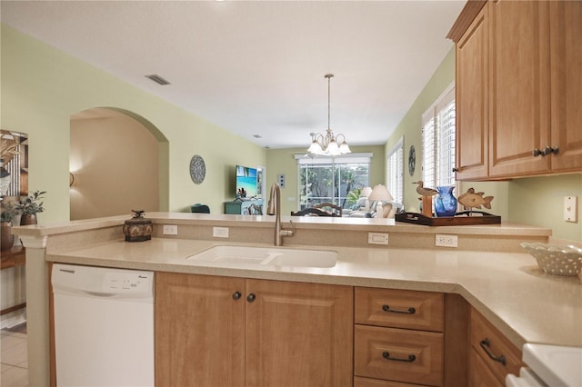 8579 54th Avenue Cir E, Bradenton, FL 34211 - kitchen with dishwasher, light countertops, open floor plan, arched walkways, and pendant lighting