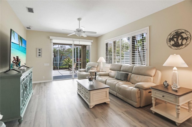 8579 54th Avenue Cir E, Bradenton, FL 34211 - living area with light wood-style floors and ceiling fan