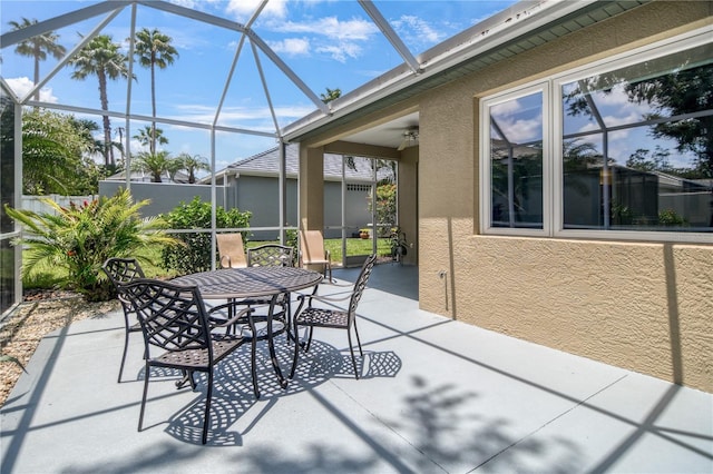 8579 54th Avenue Cir E, Bradenton, FL 34211 - view of patio with outdoor dining area and a lanai