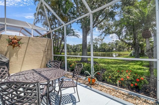 8579 54th Avenue Cir E, Bradenton, FL 34211 - sunroom with a water view and outdoor dining space