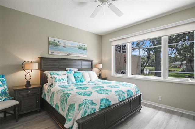 8579 54th Avenue Cir E, Bradenton, FL 34211 - bedroom featuring wood finished floors and a ceiling fan