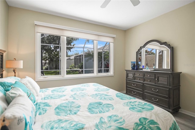 8579 54th Avenue Cir E, Bradenton, FL 34211 - bedroom with wood finished floors and ceiling fan