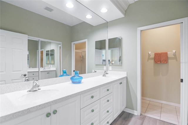 8579 54th Avenue Cir E, Bradenton, FL 34211 - bathroom featuring double vanity, a shower stall, and tile patterned floors