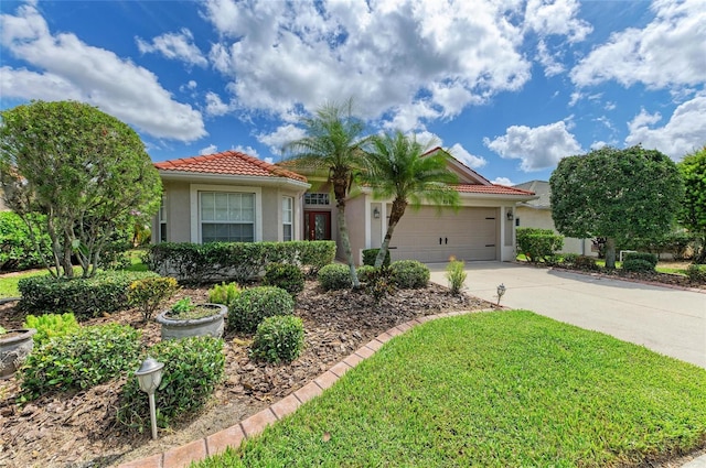 8906 Stone Harbour Loop, Bradenton, FL 34212 - view of front facade with a tiled roof, stucco siding, concrete driveway, an attached garage, and a front lawn