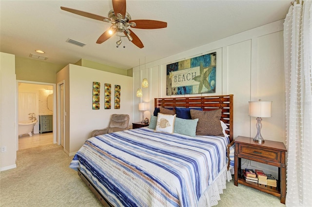 8906 Stone Harbour Loop, Bradenton, FL 34212 - bedroom with carpet, ensuite bath, and ceiling fan