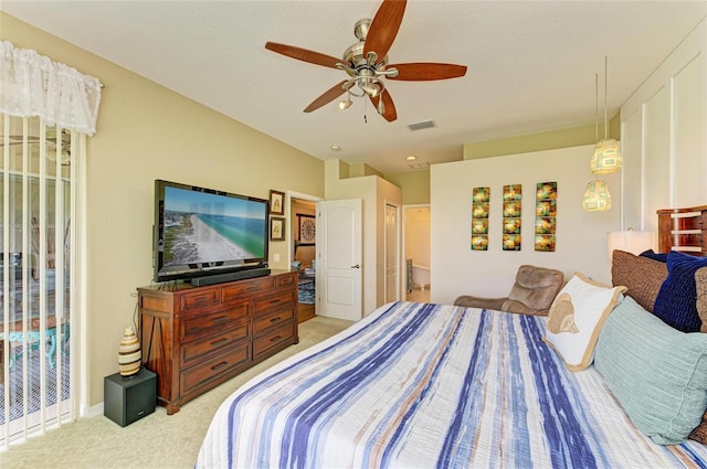 8906 Stone Harbour Loop, Bradenton, FL 34212 - bedroom featuring light colored carpet, ceiling fan, and ensuite bathroom