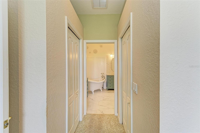 8906 Stone Harbour Loop, Bradenton, FL 34212 - hallway with a textured wall