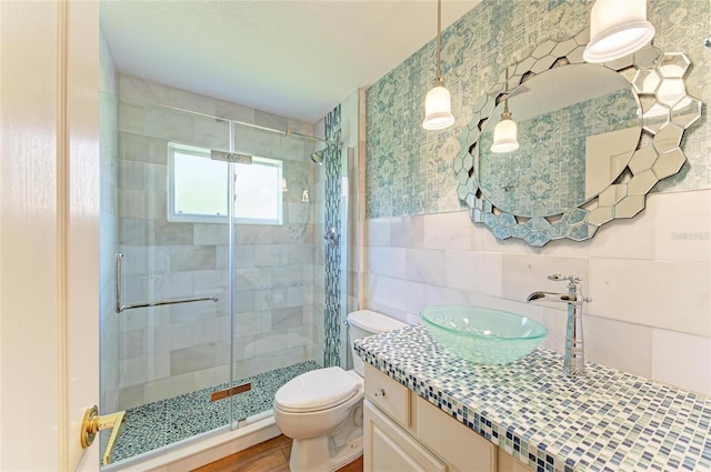 8906 Stone Harbour Loop, Bradenton, FL 34212 - bathroom with tile walls, a stall shower, and vanity
