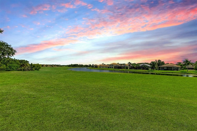 8906 Stone Harbour Loop, Bradenton, FL 34212 - yard at dusk with a water view and a yard