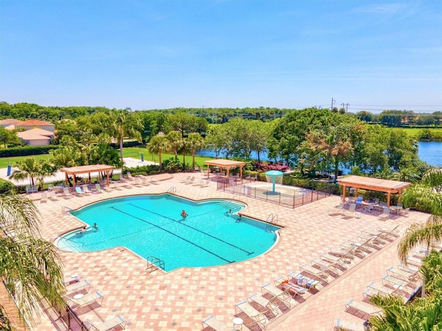 8906 Stone Harbour Loop, Bradenton, FL 34212 - community pool with a gazebo, a patio area, a pergola, and view of wooded area