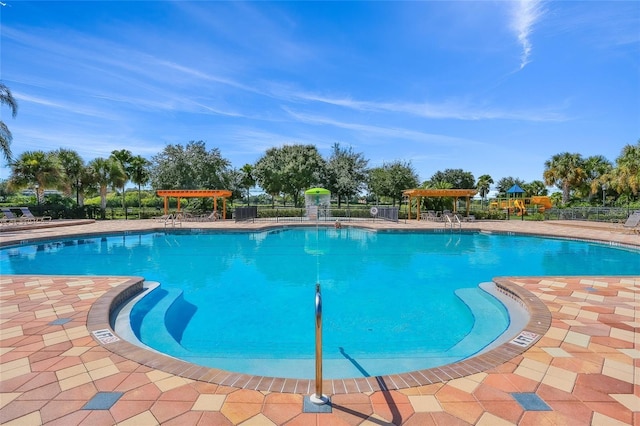 8906 Stone Harbour Loop, Bradenton, FL 34212 - community pool featuring a patio