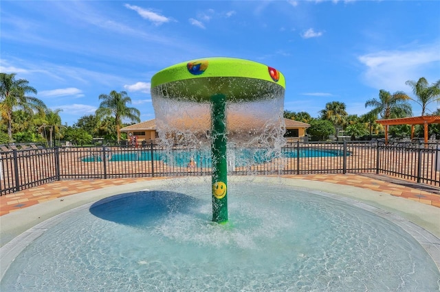8906 Stone Harbour Loop, Bradenton, FL 34212 - community pool featuring a water play area and a patio