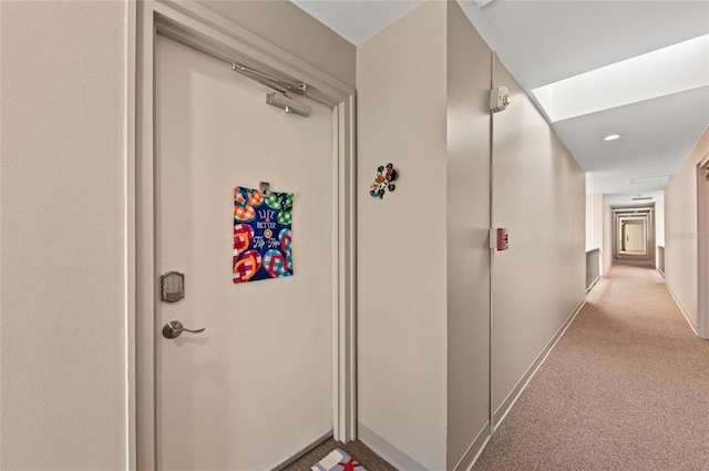 5806 Gulf Dr Unit 201S, Holmes Beach, FL 34217 - hallway featuring light carpet and baseboards