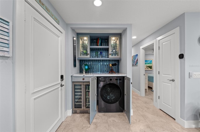 5806 Gulf Dr Unit 201S, Holmes Beach, FL 34217 - laundry area with washer / dryer, wine cooler, a dry bar, light tile patterned flooring, and recessed lighting