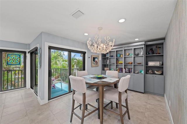 5806 Gulf Dr Unit 201S, Holmes Beach, FL 34217 - dining area with a chandelier, recessed lighting, and light tile patterned floors