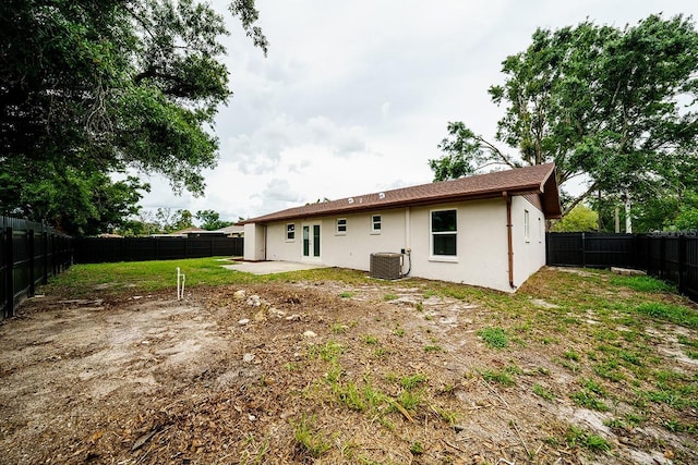 4616 34th Ave E, Bradenton, FL 34208 - back of property with stucco siding, a fenced backyard, and a patio area