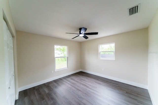 4616 34th Ave E, Bradenton, FL 34208 - empty room featuring plenty of natural light, dark wood-type flooring, and a ceiling fan