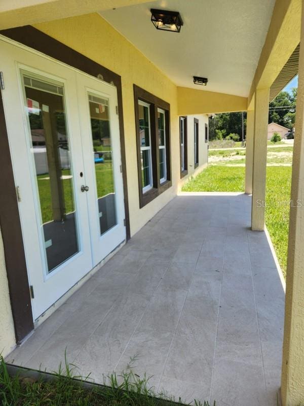 13074 SW 104th Ln, Dunnellon, FL 34432 - view of patio / terrace featuring french doors