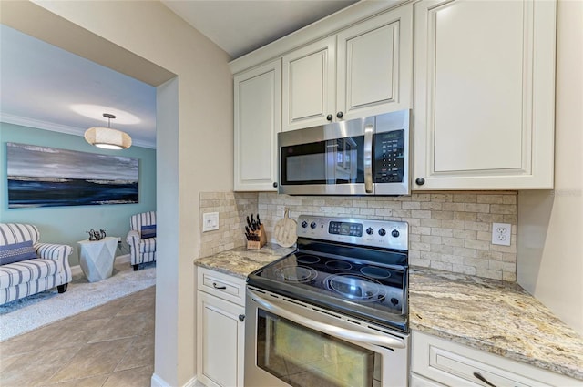4508 Mangrove Point Rd, Bradenton, FL 34210 - kitchen featuring stainless steel appliances, backsplash, light stone counters, open floor plan, and baseboards