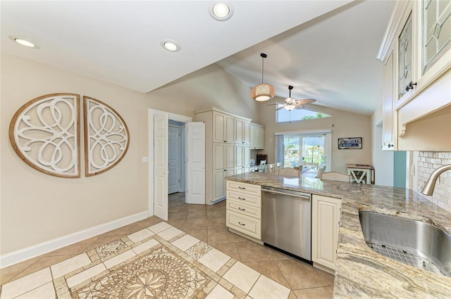 4508 Mangrove Point Rd, Bradenton, FL 34210 - kitchen with stainless steel dishwasher, a sink, light tile patterned flooring, a ceiling fan, and vaulted ceiling
