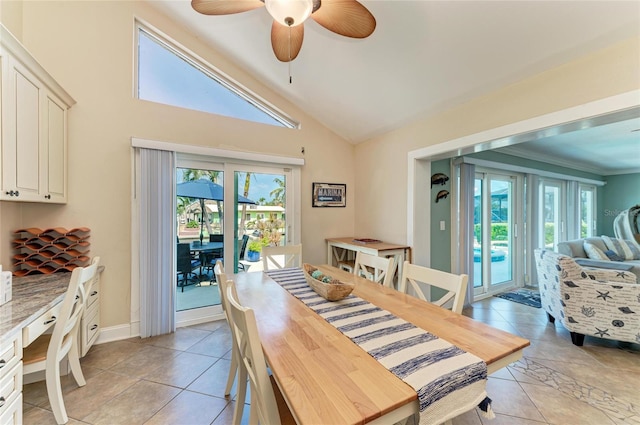 4508 Mangrove Point Rd, Bradenton, FL 34210 - dining space with ceiling fan, light tile patterned floors, and high vaulted ceiling