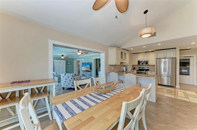 4508 Mangrove Point Rd, Bradenton, FL 34210 - dining area featuring a ceiling fan, lofted ceiling, light tile patterned floors, and recessed lighting