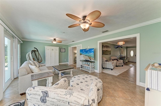 4508 Mangrove Point Rd, Bradenton, FL 34210 - living room with ceiling fan, light tile patterned floors, crown molding, and baseboards
