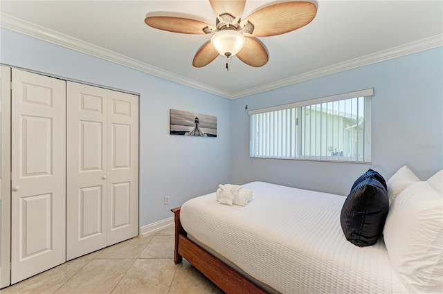 4508 Mangrove Point Rd, Bradenton, FL 34210 - bedroom with a closet, ornamental molding, light tile patterned floors, ceiling fan, and baseboards