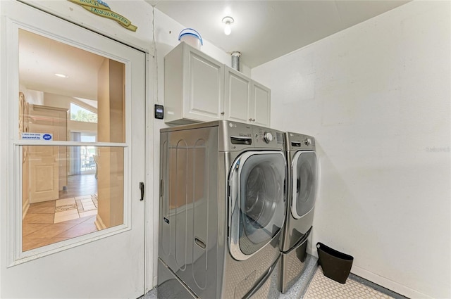 4508 Mangrove Point Rd, Bradenton, FL 34210 - laundry area featuring cabinet space, independent washer and dryer, and baseboards