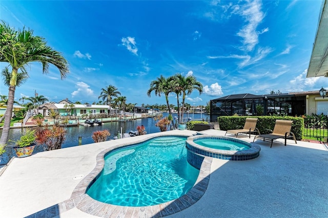 4508 Mangrove Point Rd, Bradenton, FL 34210 - view of swimming pool with a pool with connected hot tub, a water view, and a patio area