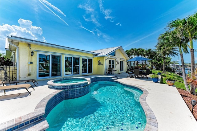4508 Mangrove Point Rd, Bradenton, FL 34210 - view of pool with a patio area, a pool with connected hot tub, and outdoor dining space