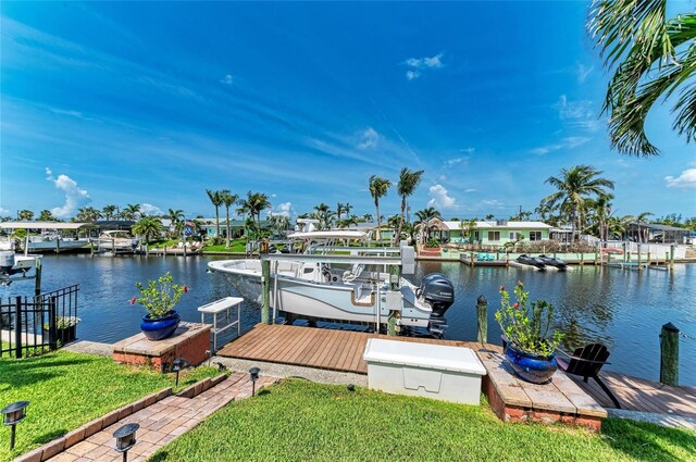 4508 Mangrove Point Rd, Bradenton, FL 34210 - dock featuring a water view, a yard, and boat lift
