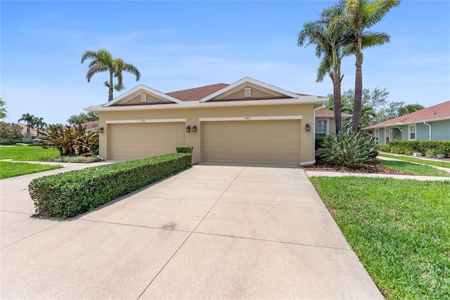 7403 Hamilton Rd, Bradenton, FL 34209 - single story home with a garage, driveway, stucco siding, and a front yard