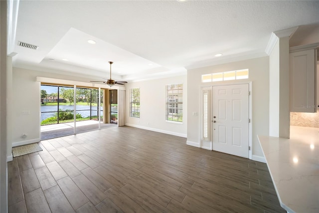7403 Hamilton Rd, Bradenton, FL 34209 - foyer entrance featuring baseboards, ceiling fan, dark wood finished floors, crown molding, and recessed lighting