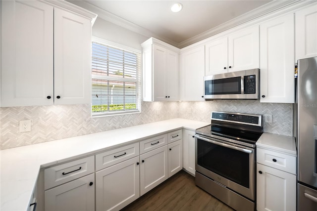 7403 Hamilton Rd, Bradenton, FL 34209 - kitchen featuring stainless steel appliances, white cabinetry, tasteful backsplash, ornamental molding, and recessed lighting