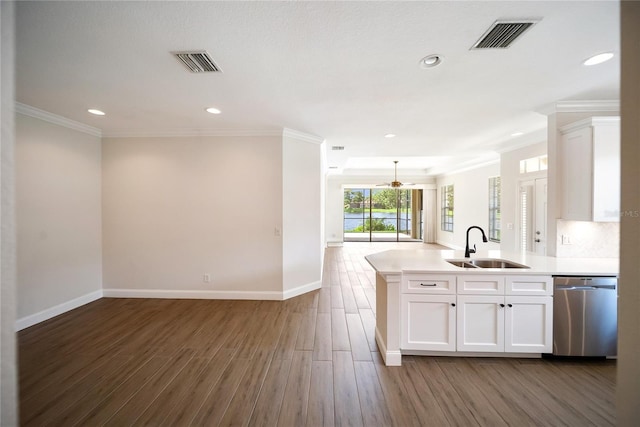7403 Hamilton Rd, Bradenton, FL 34209 - kitchen with dishwasher, a sink, a peninsula, open floor plan, and recessed lighting