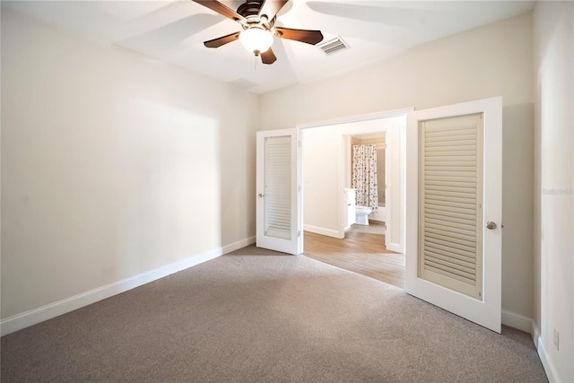 7403 Hamilton Rd, Bradenton, FL 34209 - unfurnished bedroom featuring carpet flooring, baseboards, and a ceiling fan