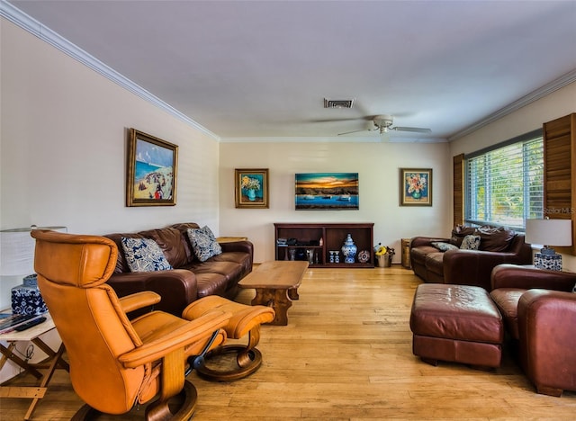2216 Lake Shore Dr, Nokomis, FL 34275 - living room featuring crown molding, light wood-type flooring, and a ceiling fan