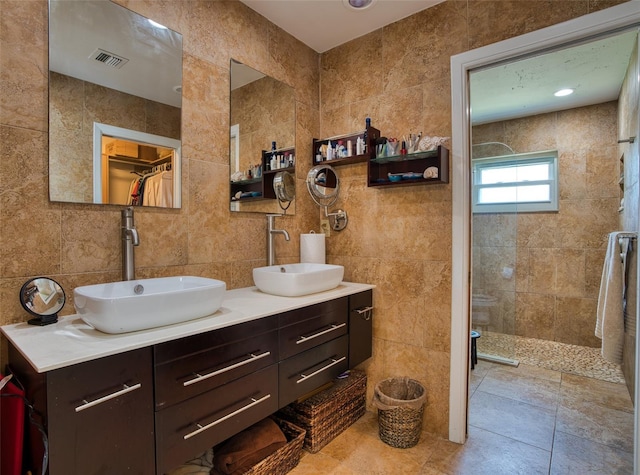 2216 Lake Shore Dr, Nokomis, FL 34275 - full bathroom featuring tile walls, walk in shower, and double vanity