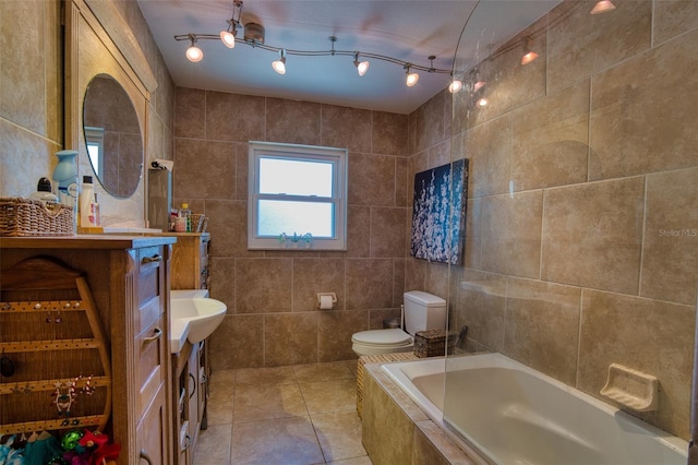 2216 Lake Shore Dr, Nokomis, FL 34275 - bathroom with tile walls, tiled bath, tile patterned floors, and vanity