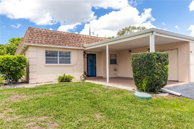 643 Park Cir, Bradenton, FL 34207 - view of front of property with a shingled roof, a front yard, and an attached carport