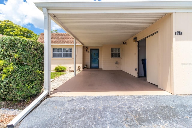 643 Park Cir, Bradenton, FL 34207 - view of patio featuring an attached carport