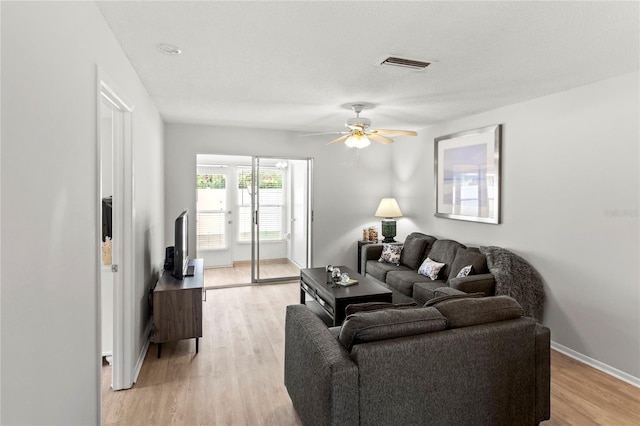643 Park Cir, Bradenton, FL 34207 - living area with ceiling fan and light wood-style flooring
