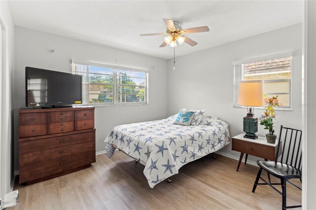 643 Park Cir, Bradenton, FL 34207 - bedroom featuring light wood-type flooring and ceiling fan