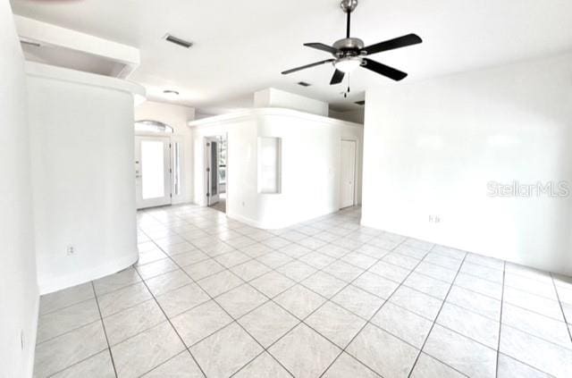 11315 Cypress Shore Ct, Clermont, FL 34711 - unfurnished room featuring ceiling fan and light tile patterned floors