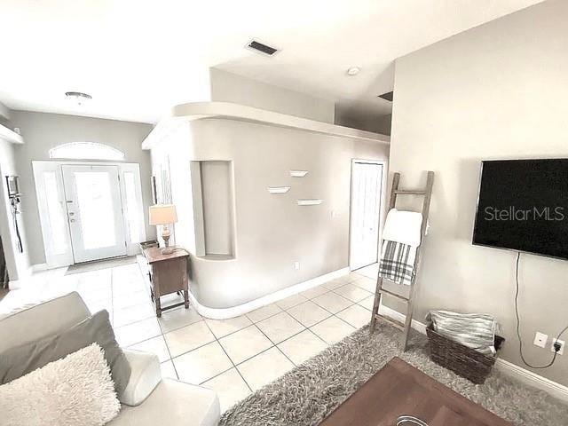 11315 Cypress Shore Ct, Clermont, FL 34711 - living area with light tile patterned floors and baseboards