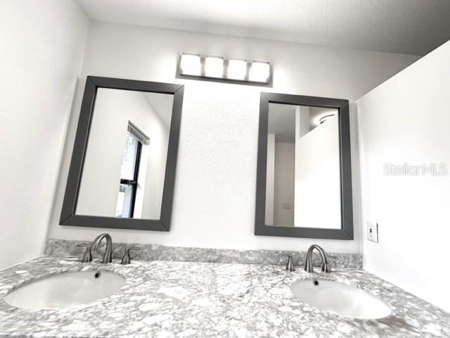 11315 Cypress Shore Ct, Clermont, FL 34711 - full bath featuring double vanity